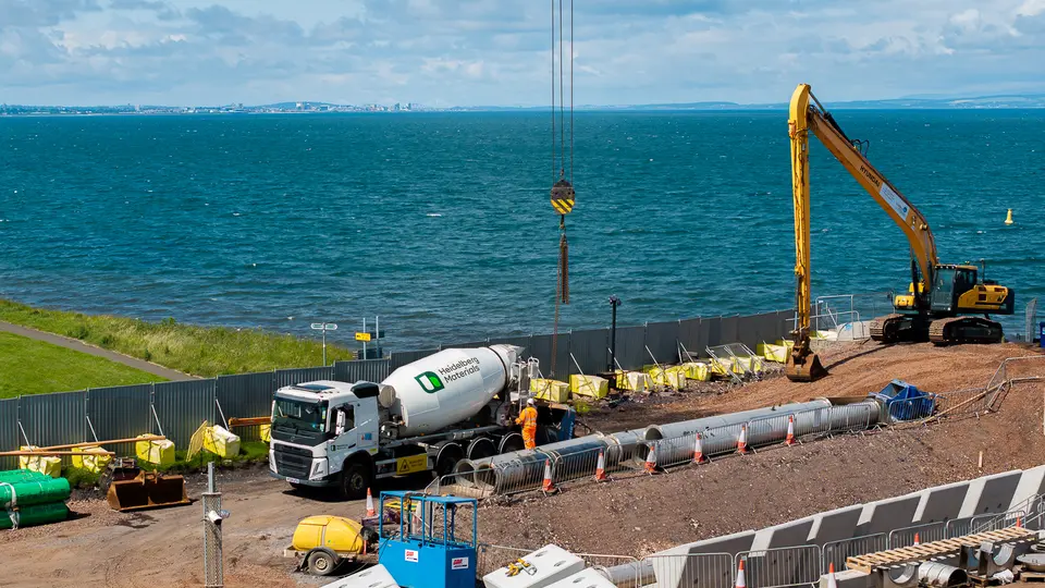 Heidelberg Materials concrete truck at seaside construction site
