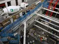 A construction site with workers, scaffolding, and a Heidelberg Materials ready-mixed concrete truck in the background.